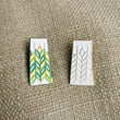 Load image into Gallery viewer, These pins are inspired by the quilts of our grandmothers and the patchwork of the fields of grain.
