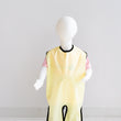 Load image into Gallery viewer, Waterproof full length bib un Sun (yellow). Discover 100% Canadian-made quality, crafted with care &amp; honouring Indigenous beliefs with unique gender-neutral Grass, Water, &amp; Sun hues. Our Waterproof PUL material makes for easy cleanup while two leg loops &amp; adjustable breakaway neck snaps provide full-body coverage &amp; fit a wide range of sizes.
