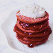 Load image into Gallery viewer, Pink chia pancakes made using the Beetroot Blume blend. 
