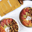 Load image into Gallery viewer, Turmeric Mango Sunrise Bowl made using the turmeric Blume blend.
